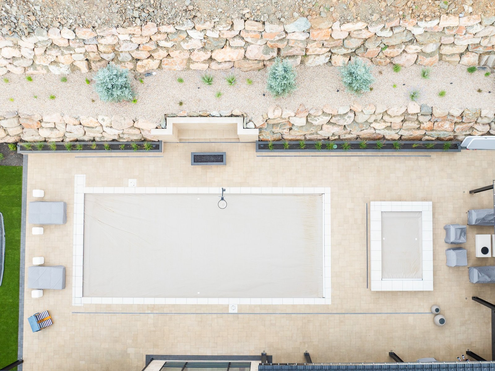 Outdoor living area with fire feature and evening lighting at a Northern Utah home