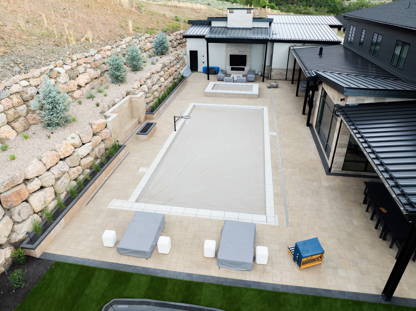 Pool and integrated hardscape courtyard at a Northern Utah property